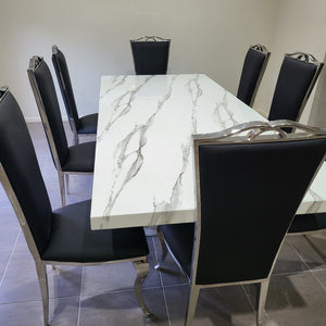 Classy Marble Dining Table With Classic Black leather Style Dining Room Chairs in Silver Stainless Steel Frame