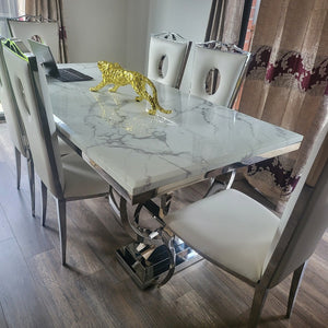 Classy Marble Dining Table With Circle White Leather Style Dining Room Chairs in Silver Stainless Steel Frame