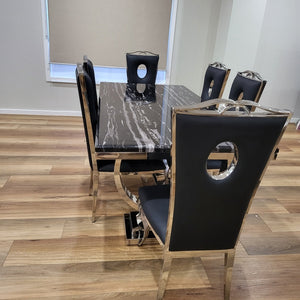 Stylish and Modern Classic Marble Dining Table With White Leather Dining Room Chairs in Silver Stainless Steel Frame