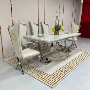 Classy Rectangular Marble Dining Table with Silver Stainless Steel frame and cream velvet chairs
