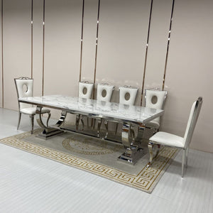 Classic Marble Dining Table With White Circle Leather Dining Room Chairs in Silver Stainless Steel Frame